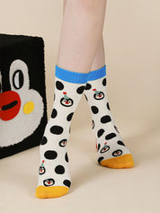 Calzini con pois e pinguino da cartone animato carino