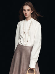 Blusa con maniche a sbuffo e collo finto