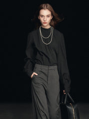 Blusa con maniche a sbuffo e collo finto